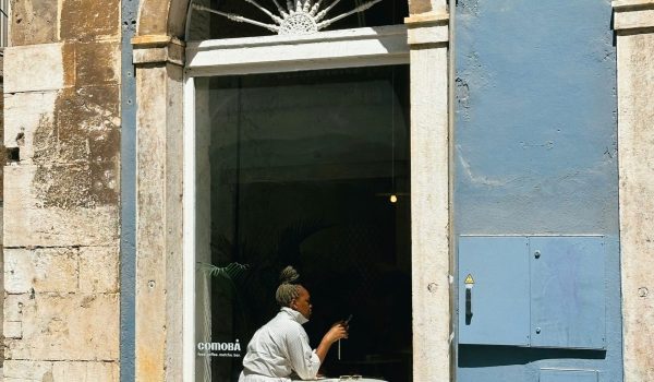 cover-Sunlit-cafy-window-in-Lisbon-with-a-person-enjoying-a-drink-inside